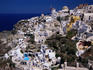 Southern Aegean village of Oia perched on Santorini crater rim.