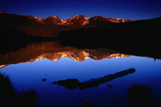 Sprague Lake provides a perfect mirror for the surrounding mountains in the Rocky Mountain National Park.