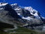 Tour buses make their way up to the Athabasca Glacier in the Icefields Parkway.