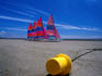 Colourful catamarans on the beach.