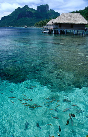 Bungalows over the waters of Bora Bora Lagoon.