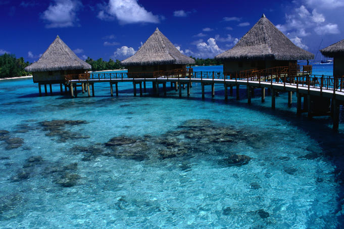 Stilt bungalows over the waters of Rangiroa Lagoon.