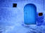 Alleys and doorways painted blue to repel insects in the Rif Mountains.