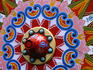 Brightly decorated carriage wheel in San Jose.