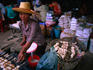 A vendor at the Siem Reap market cooks fried bananas, a favourite dessert.