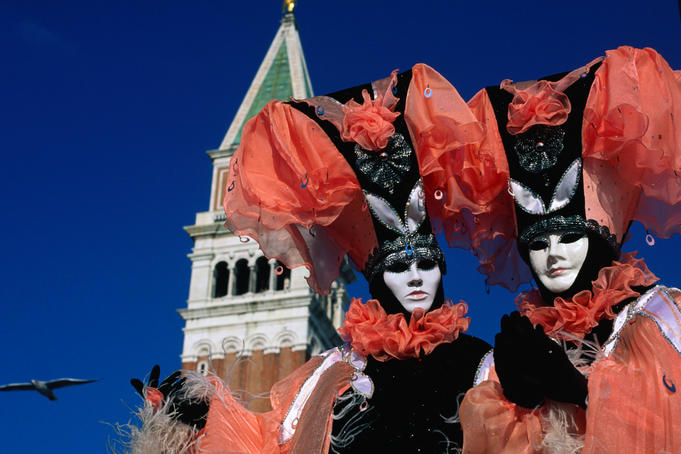 Costumed and masked carnival participants.