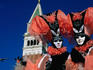 Costumed and masked carnival participants.