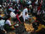 Lighting candles at Asan Tole in Kathmandu in readiness for the Nepalese New Year, the celebration is in mid April and it's celebrated with two of Nepal's most colourful festivals, Bisket Jatra and the Bal Kumari Festival