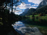 Clouds above, and reflected in, the still waters of Hintersee in the Bavarian Alps.