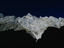 Bare rock peaks of Mittelspitze (2713m), the second highest mountain in Germany, draped in shadow.