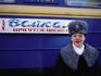 A Prodvodnista (carriage attendant) standing in front of No 9 and 10 Baikal train.