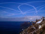 A stream of aeroplane smoke patterns the sky over Lake Baikal at Listvyanka.
