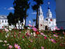 Colourful flowers in front of the surviving bell-tower (1841) and Assumption Cathedral (Uspensky sobor), 1866, of the Bogolyubovo monastery.
