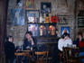 Customers sit in the rustic interior of the Blue Light Jazz Bar in Mala Strana.