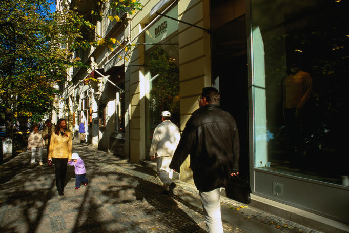 Window shopping along the boutiques of Parizska Street in Prague.