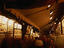 Street artists at night sell their wares at an Alley off Place d'Armes.