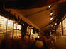 Street artists at night sell their wares at an Alley off Place d'Armes.