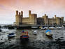 Historic Caernarfon Castle in Gwynedd (Wales). The castle, originally fortified in 1090, was allegedly modelled on the 5th century walls of Constantinople.