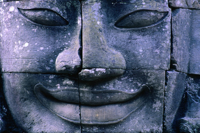 Close up of smiling face of Avalokiteshvara, Bayon, Angkor Thom.