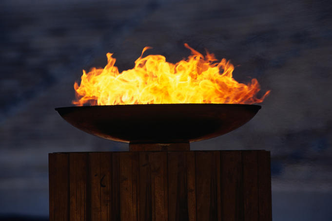 The Olympic flame burning brightly in the reconstructed Stadium of Athens.