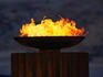 The Olympic flame burning brightly in the reconstructed Stadium of Athens.