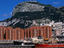 Port and apartment blocks beneath rock of Gibraltar.