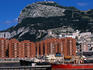 Port and apartment blocks beneath rock of Gibraltar.