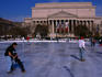 Skating in the Washington DC National Sculpture Garden and behind the rink, the landmark National Archive building.