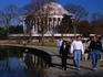 People walking beside Tidal Basin near the Thomas Jefferson Memorial.