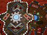 Craft decoration with inlaid buttons and mirrors.