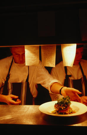 Chefs prepare meals at one of Melbourne's premier restaurants.