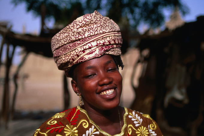 Portrait of woman wearing headpiece.