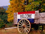 Welcome sign on wagon in rural New England.