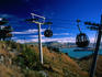Aerial Gondola ferrying passengers to the summit of Mt Cavendish, with a view over Lyttelton Harbour.