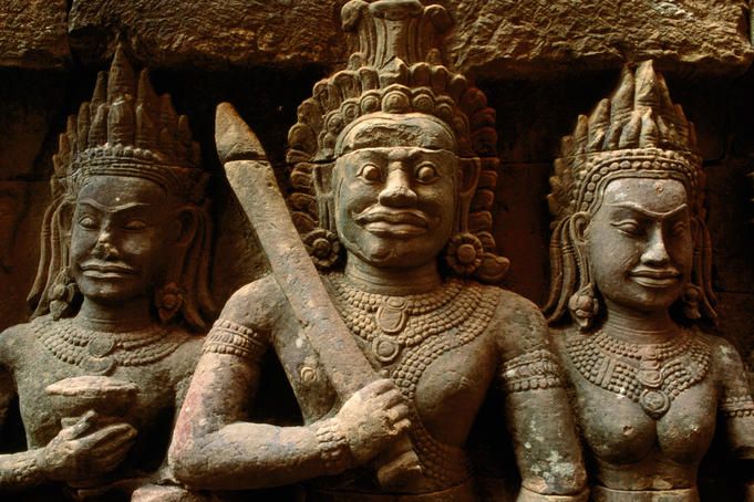 Statue of king with sword and two court figures at Terrace of the Leper King, Angkor Thom.