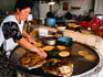 Cooking of sopes (corn dough) tortillas and gorditas (fried maize with refried beans).