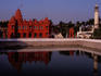 The Digambara Jain Temple by the banks of a body of water.