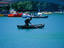 A man making hard work of rowing on a lake in Genclik Parki in central Ankara.