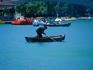 A man making hard work of rowing on a lake in Genclik Parki in central Ankara.