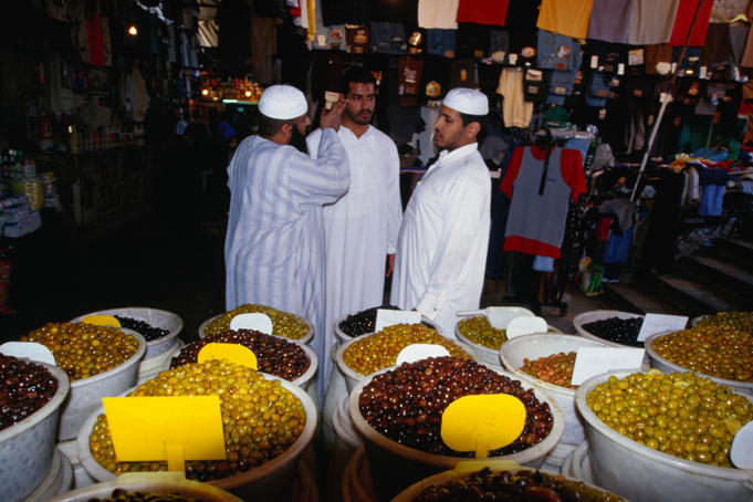 Discussing life, the universe and olives at a Damascus souq.